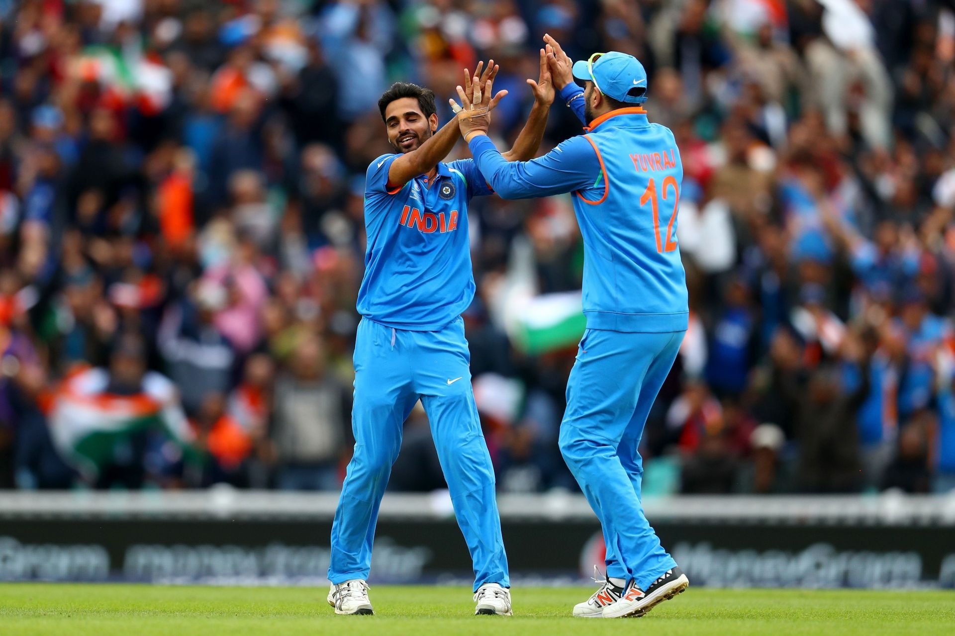 Bhuvneshwar Kumar (L) celebrates a wicket. (Credits: Getty)