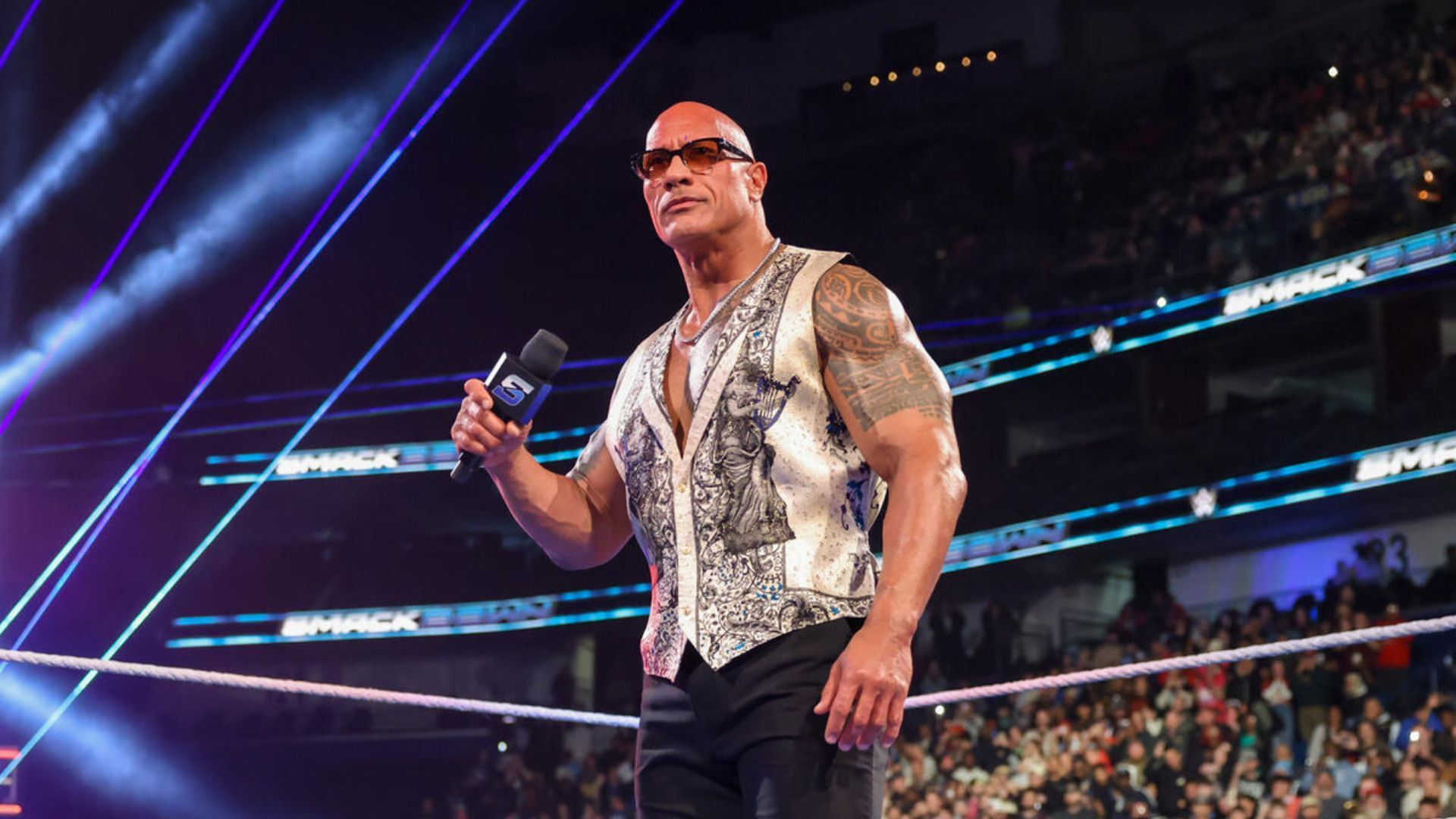 The Rock is a former WWE Champion. [Image via WWE.com]