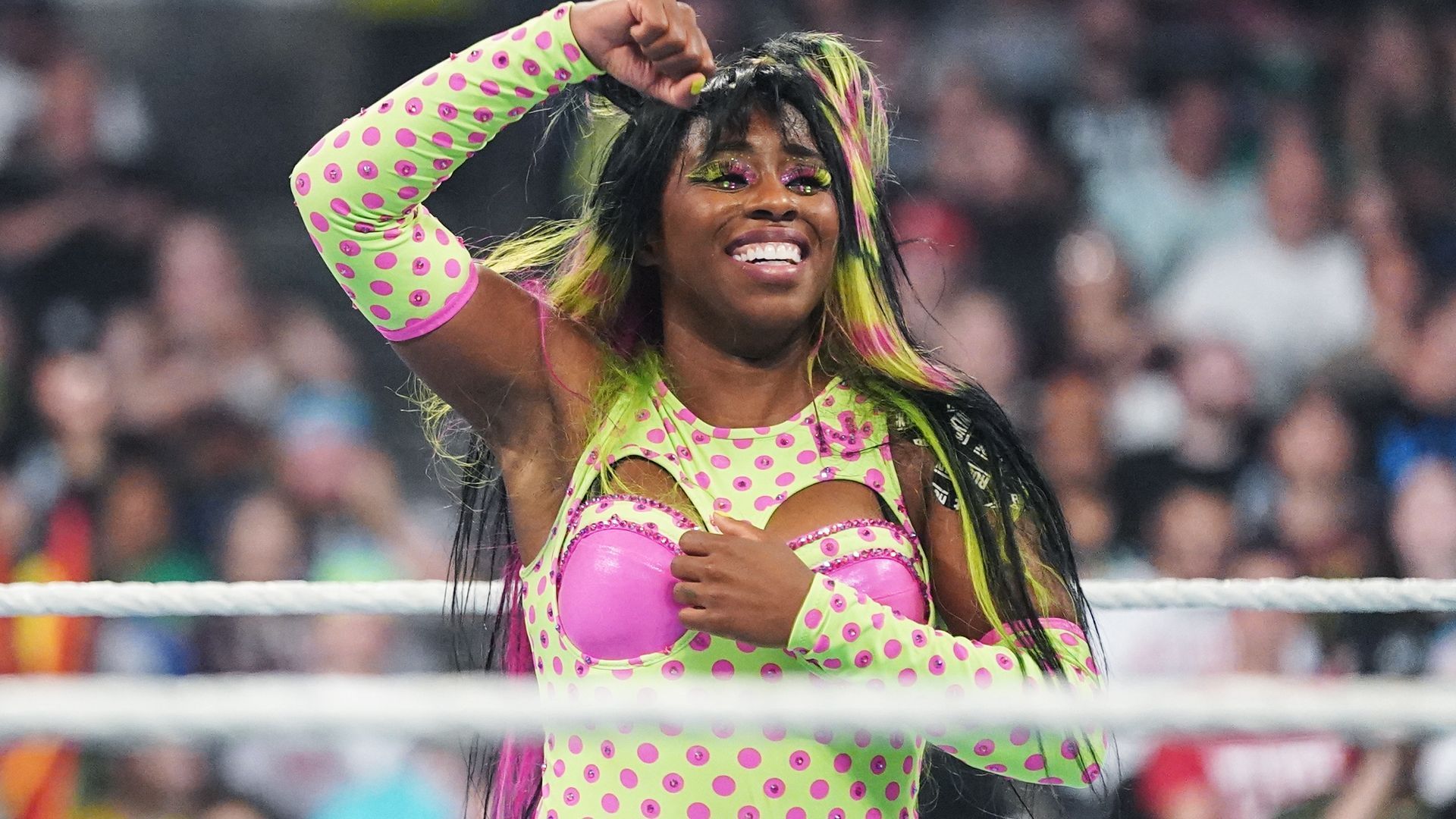 WWE Superstar Naomi smiles for the crowd