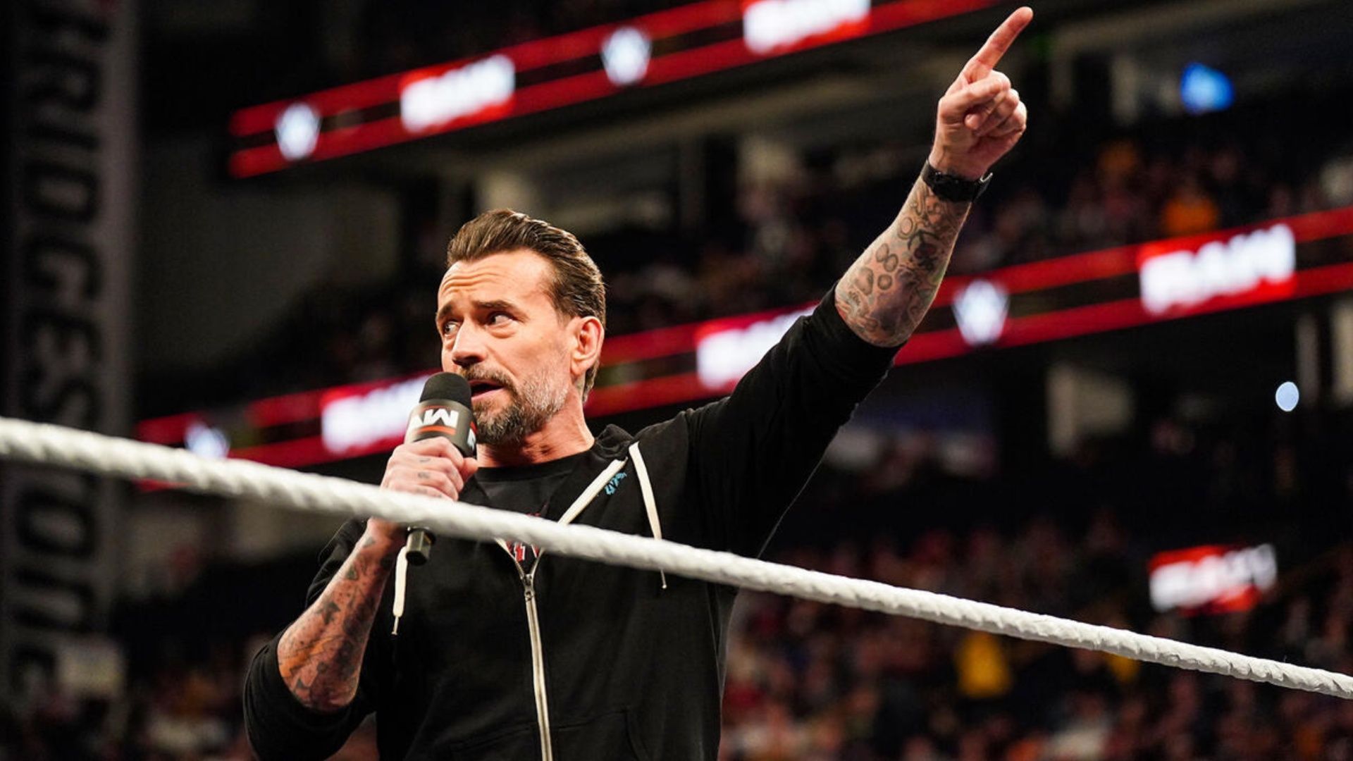 CM Punk cuts a promo at a WWE event (Image via WWE.com).