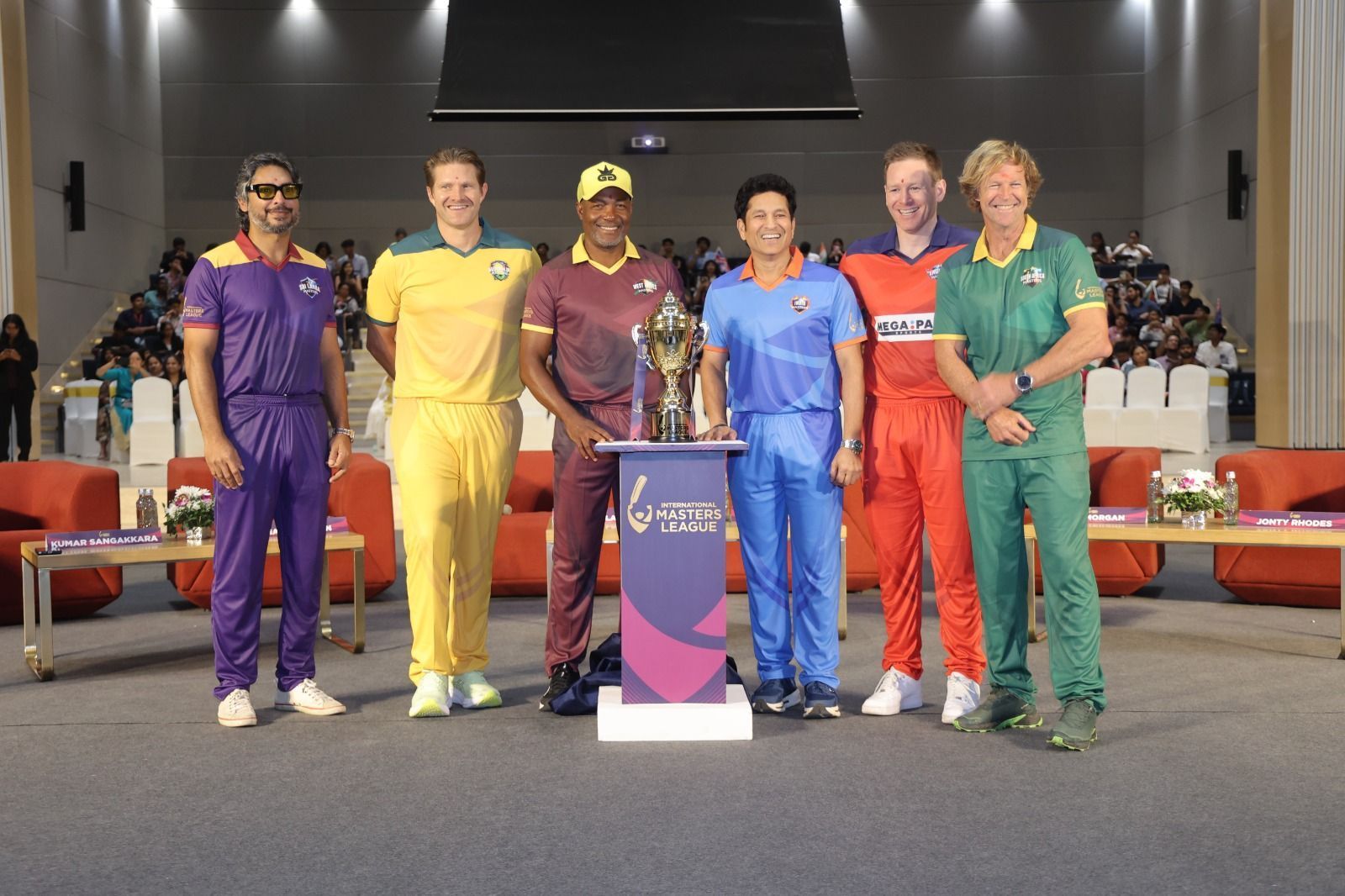 Captains pose with the International Master League 2025 trophy