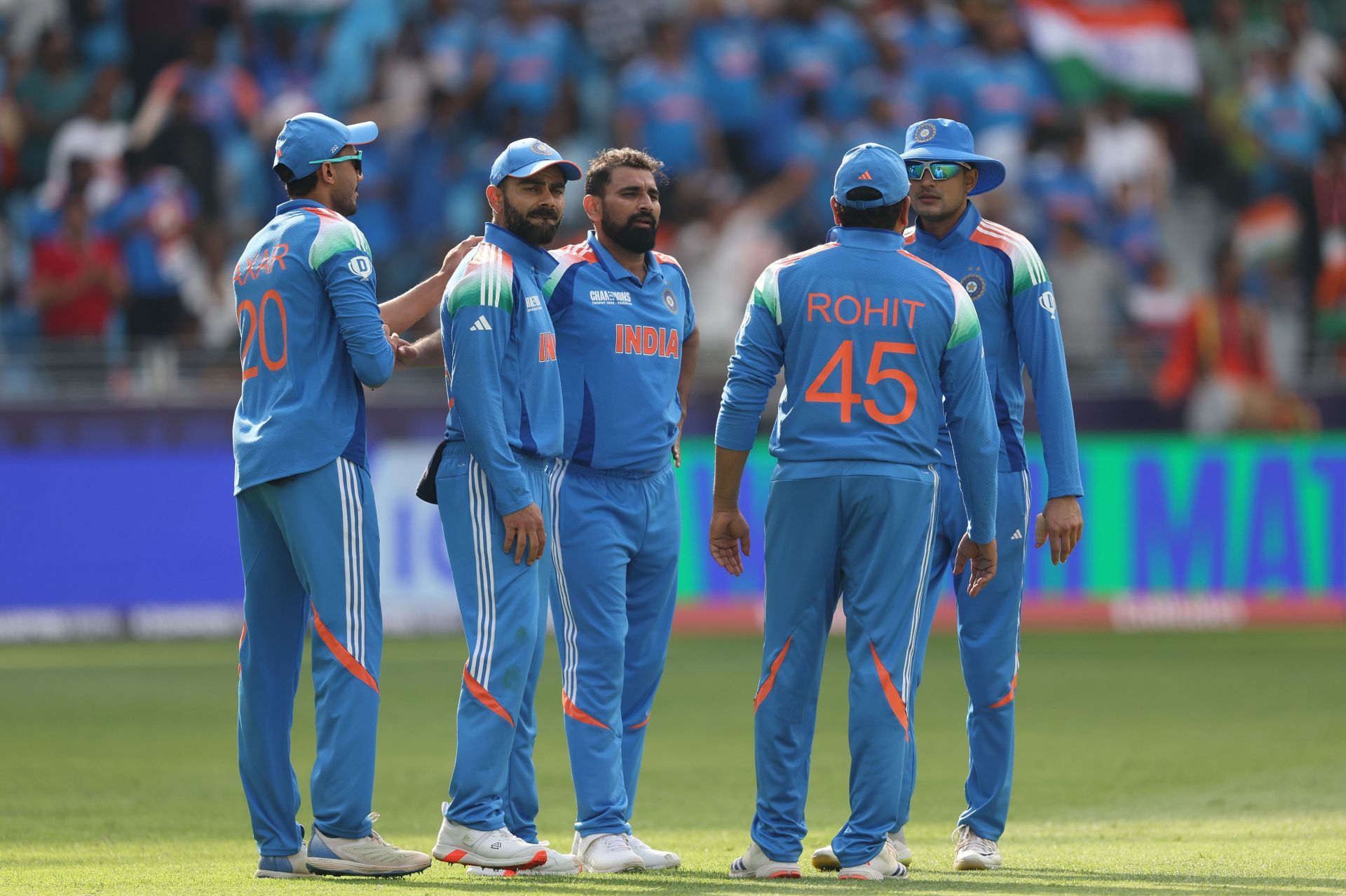 Shami celebrates with teammates after picking his 200th ODI wicket. Source: Getty