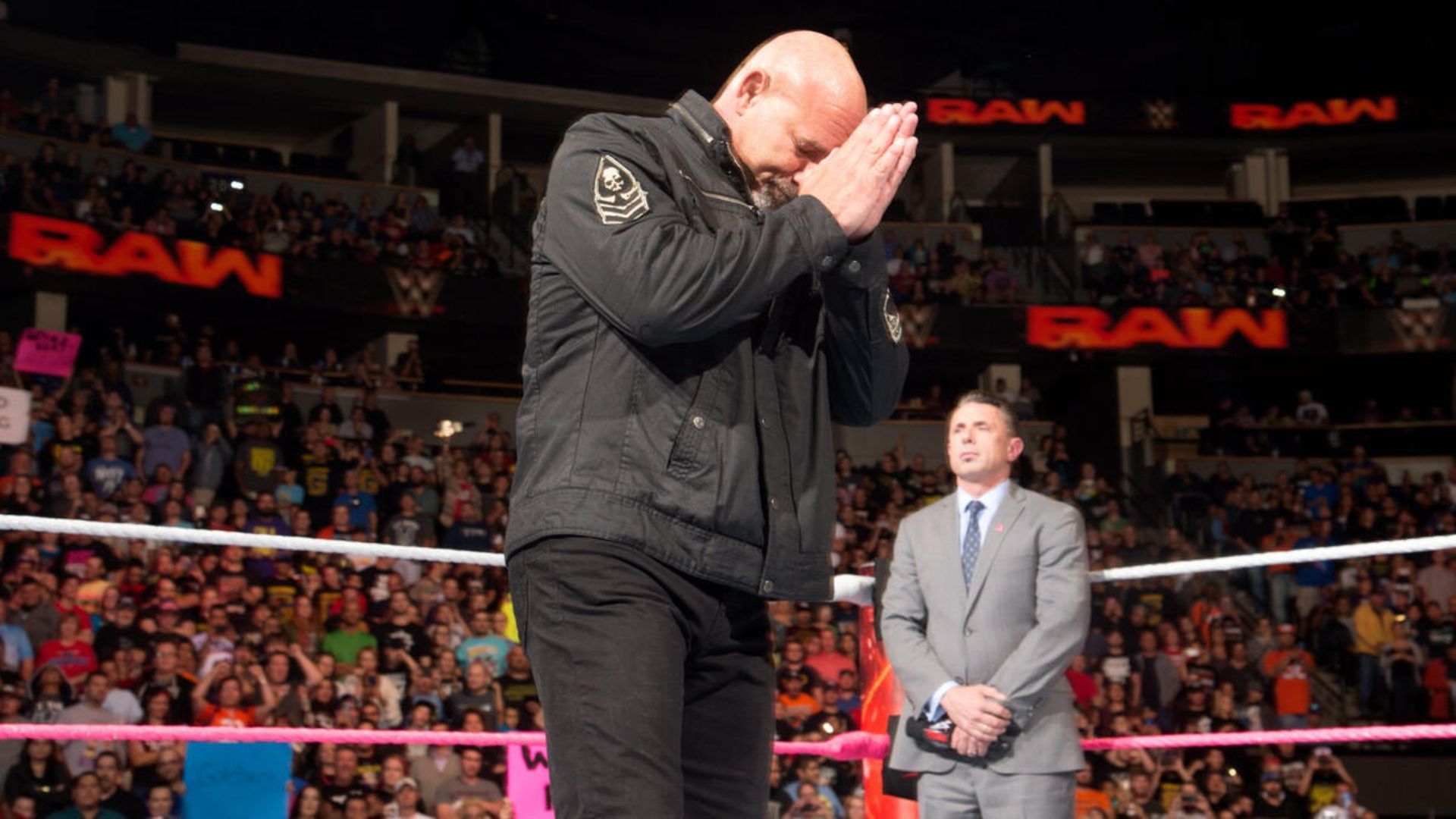 Goldberg alongside Michael Cole in frame on an episode of RAW. [Picture from WWE.com]