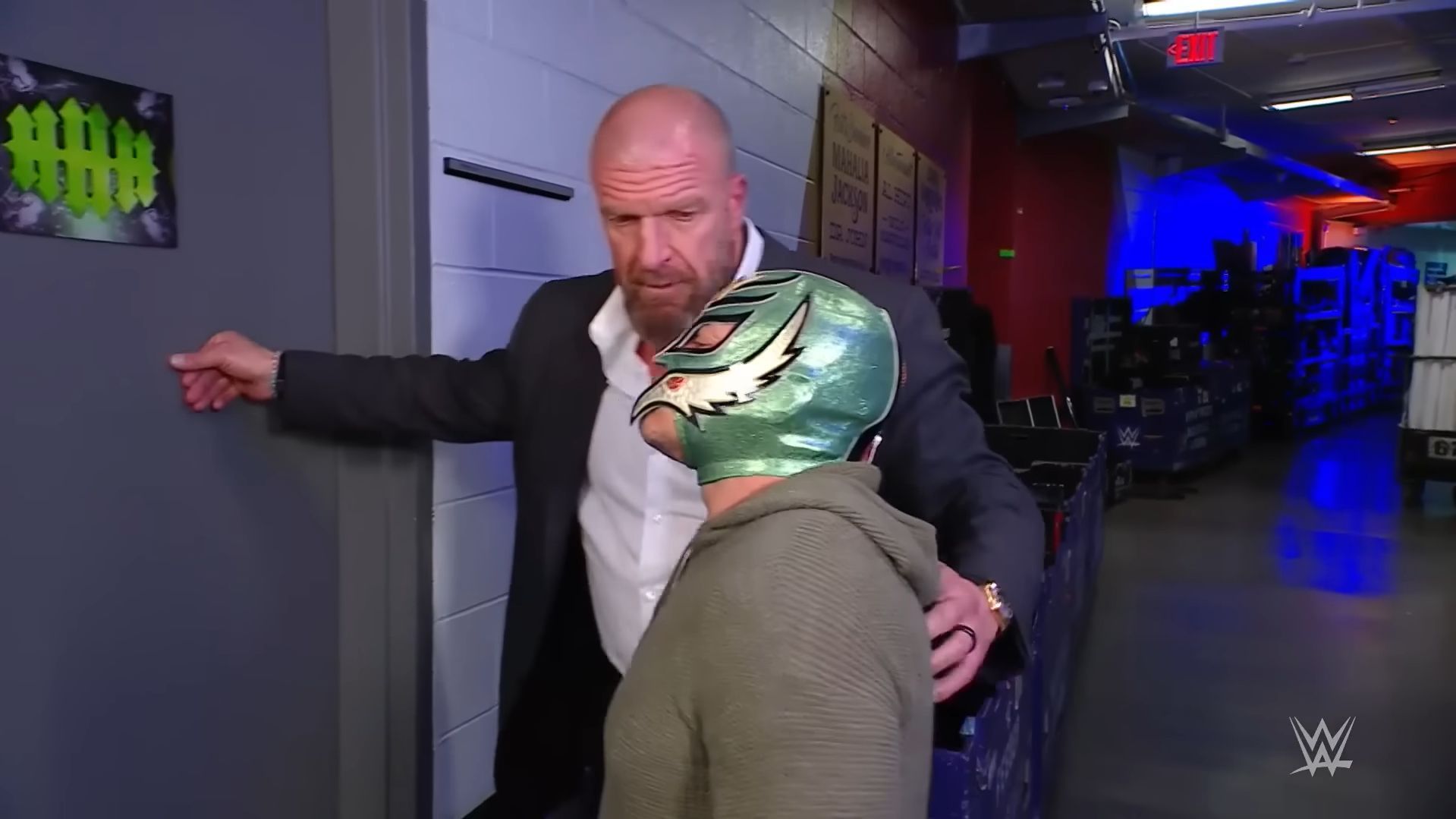 Mysterio with Triple H (via WWE