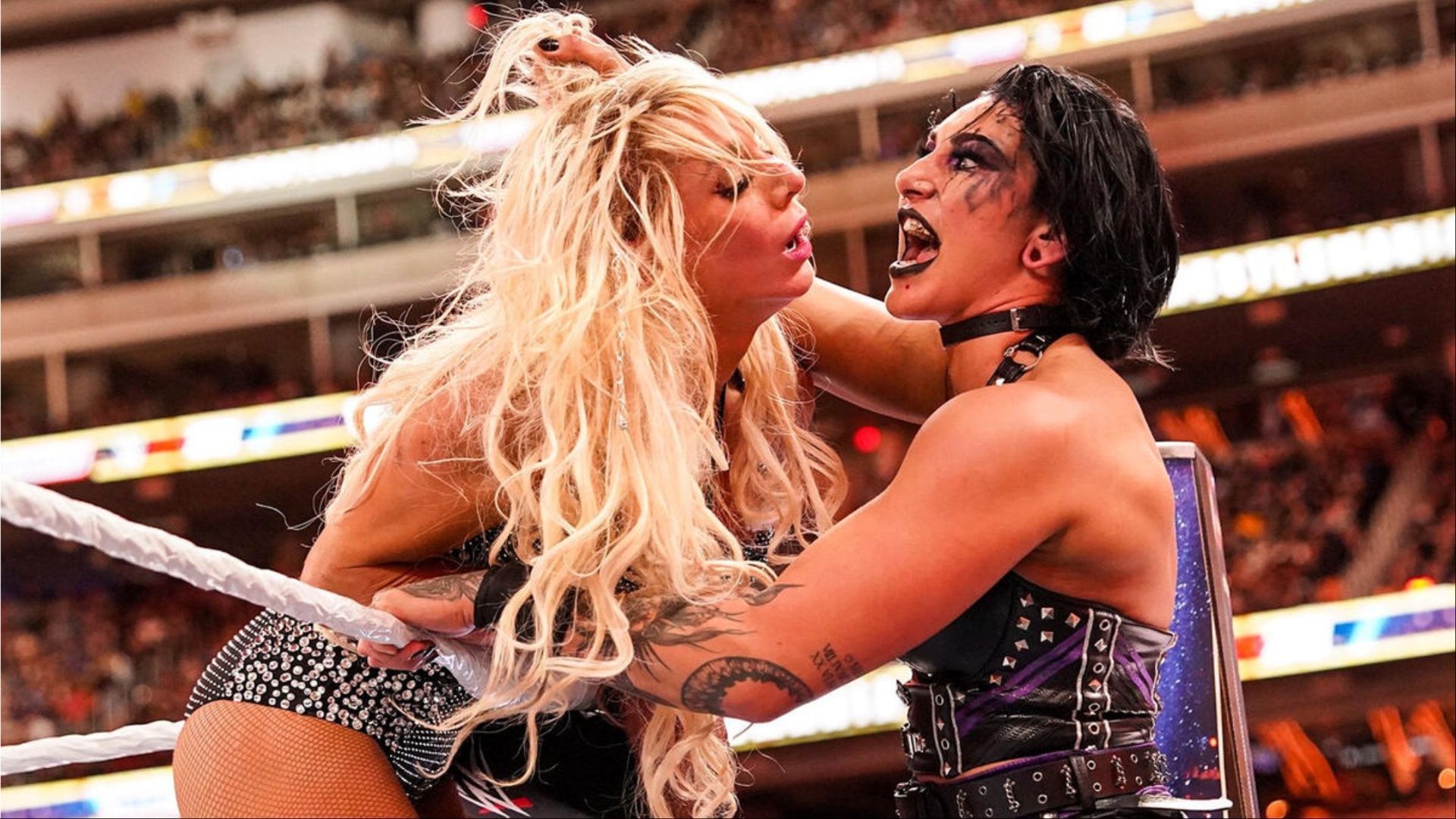 Charlotte Flair and Rhea Ripley at WrestleMania 39. (Photos: WWE.com)