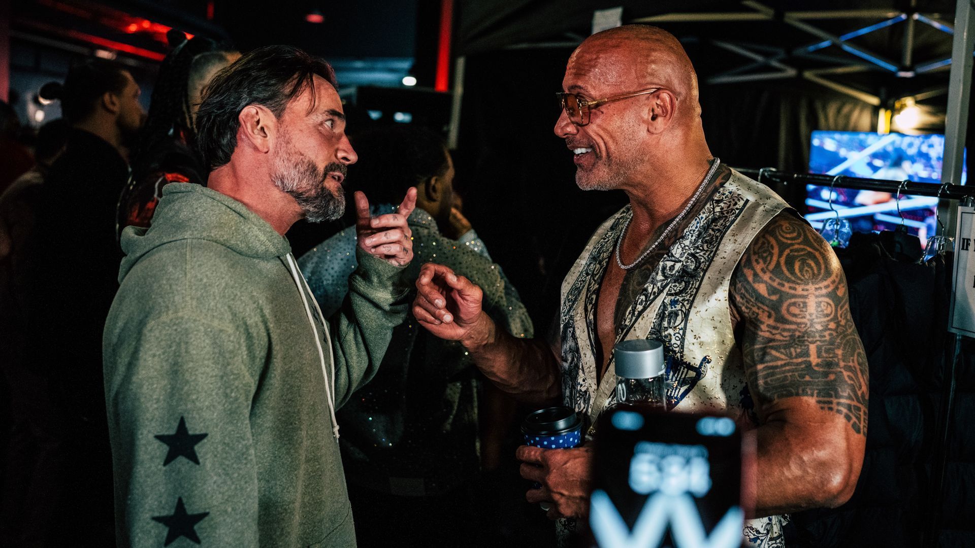 CM Punk and The Rock talking backstage at WWE RAW