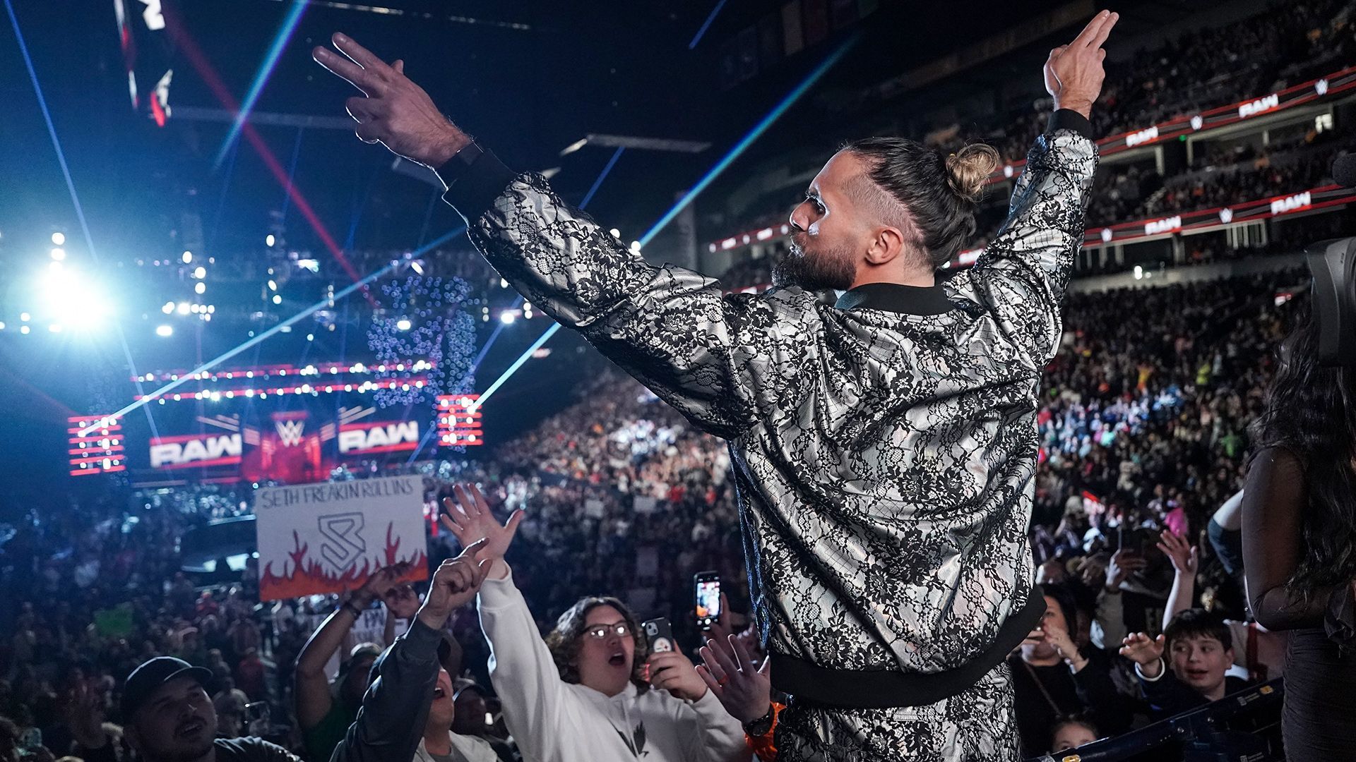 Seth Rollins poses for the WWE Universe on RAW