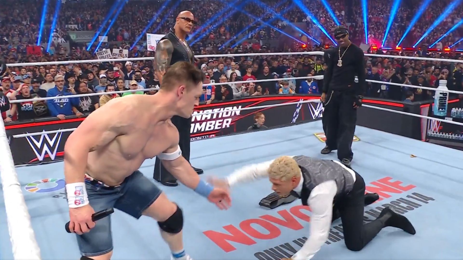 John Cena attacking Cody Rhodes as The Rock and Travis Scott look on [Image Credits: WWE