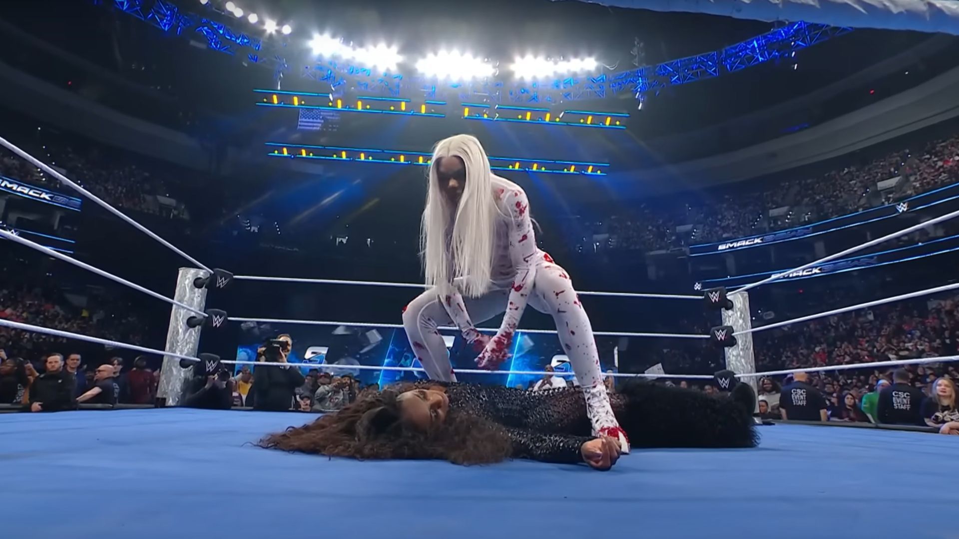 Jade Cargill standing over Naomi after attacking her [Image Credits: WWE