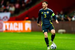 Andy Robertson points at captain's armband and appears to shout at Liverpool teammate during Scotland's UEFA Nations League clash