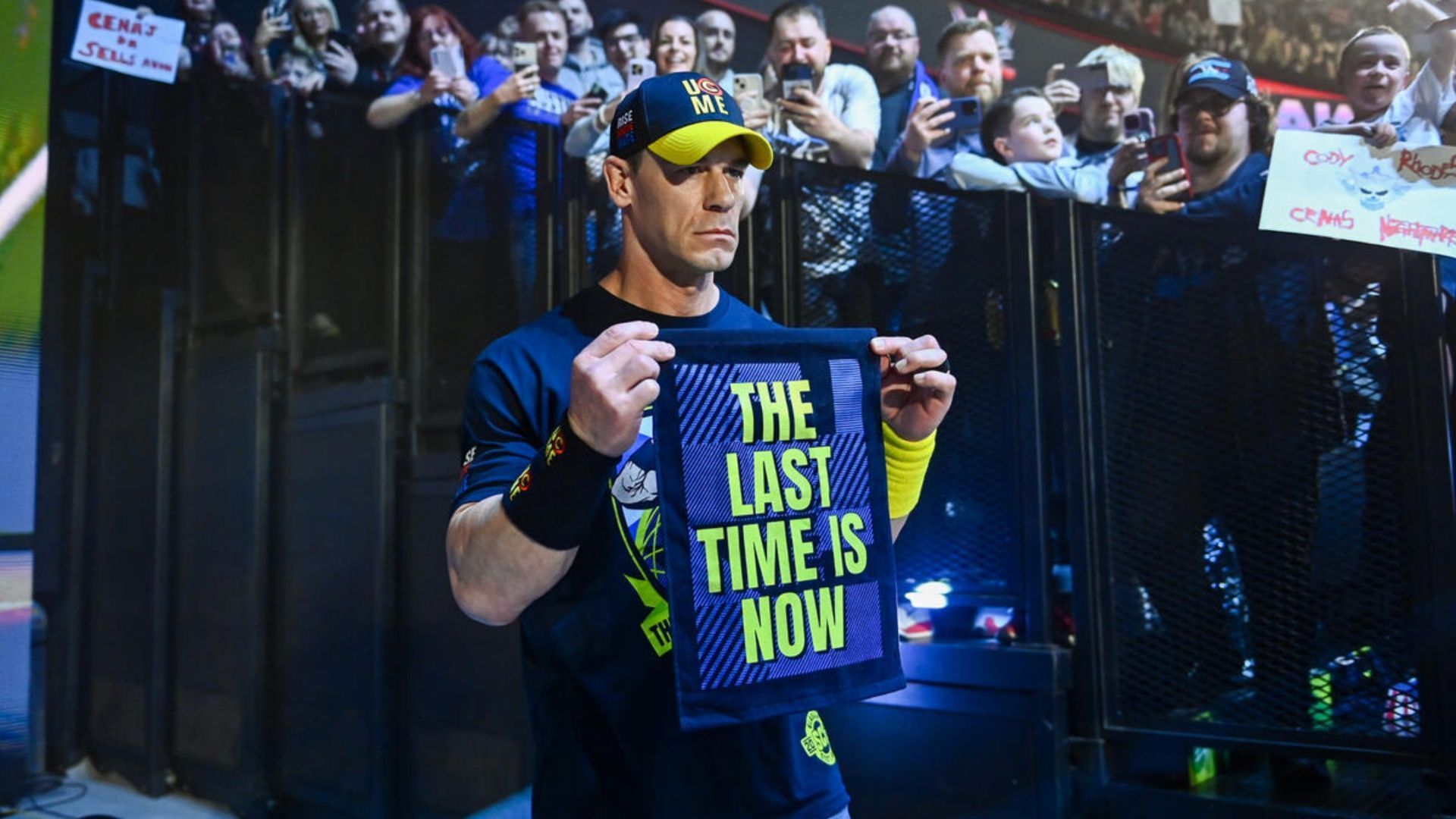 John Cena shows his merchandise ahead of his promo on WWE RAW (Image via WWE.com).