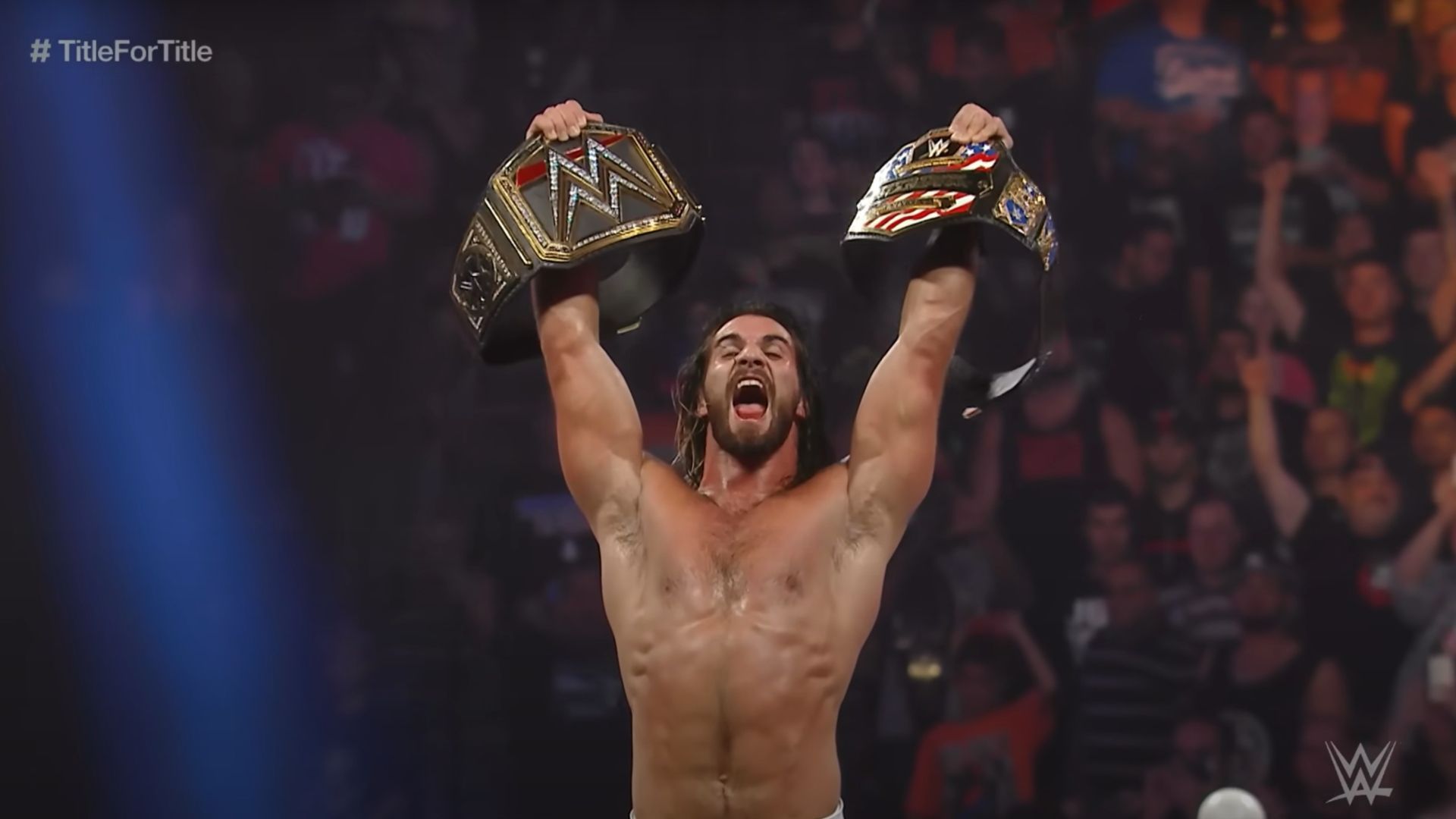 Seth Rollins holding the WWE World Heavyweight Championship and the United States Championship [Image Credits: WWE