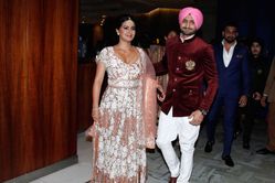 Harbhajan Singh and wife Geeta Basra pose for a family picture with Shilpa Shetty and Raj Kundra