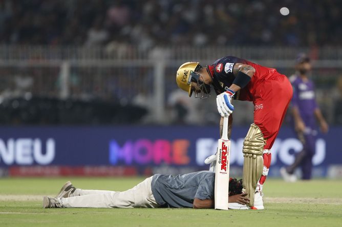 Pitch invader falls on Virat Kohli's feet during KKR vs RCB IPL 2025 opener [Watch]