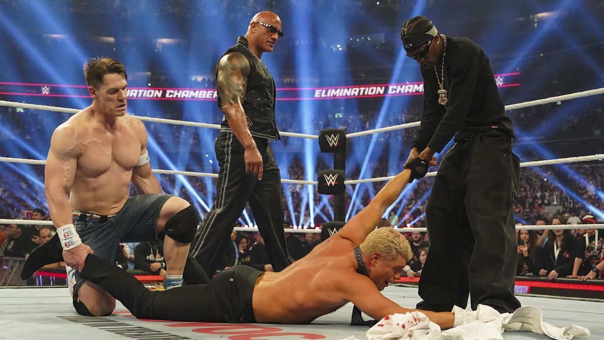 John Cena, The Rock and Travis Scott beat up Cody Rhodes. (Photo: WWE.com