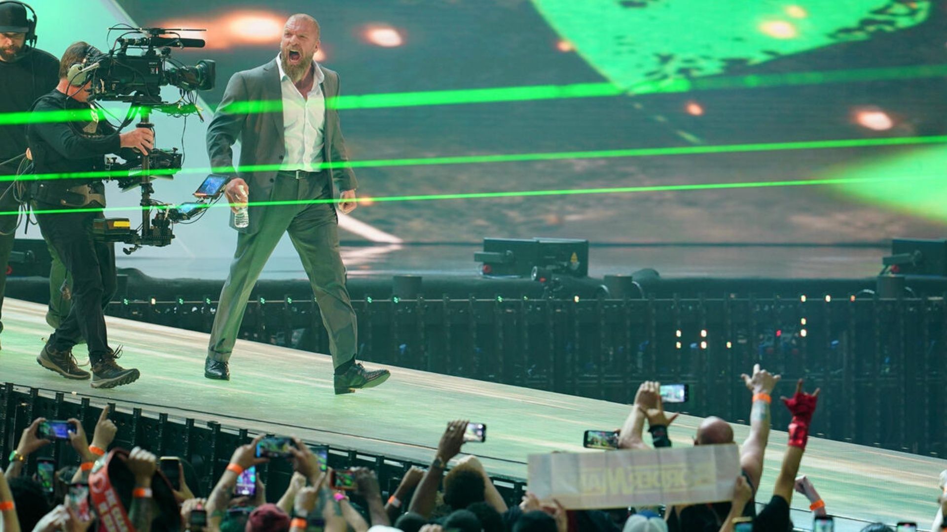 Triple H walks towards the WWE ring (Image via WWE.com).