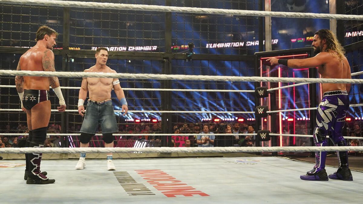 Seth Rollins with John Cena and CM Punk at Elimination Chamber (Photo credit: WWE.com)