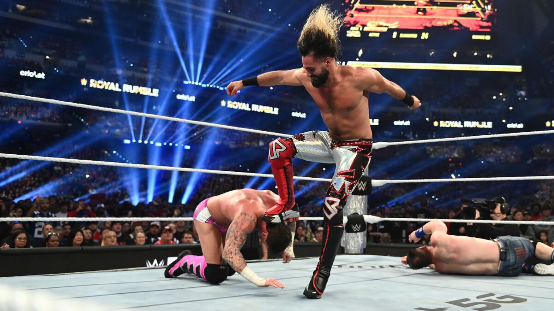 Will Seth Rollins get the better of CM Punk by finishing him off with another stomp? (Image Credit: WWE.com)