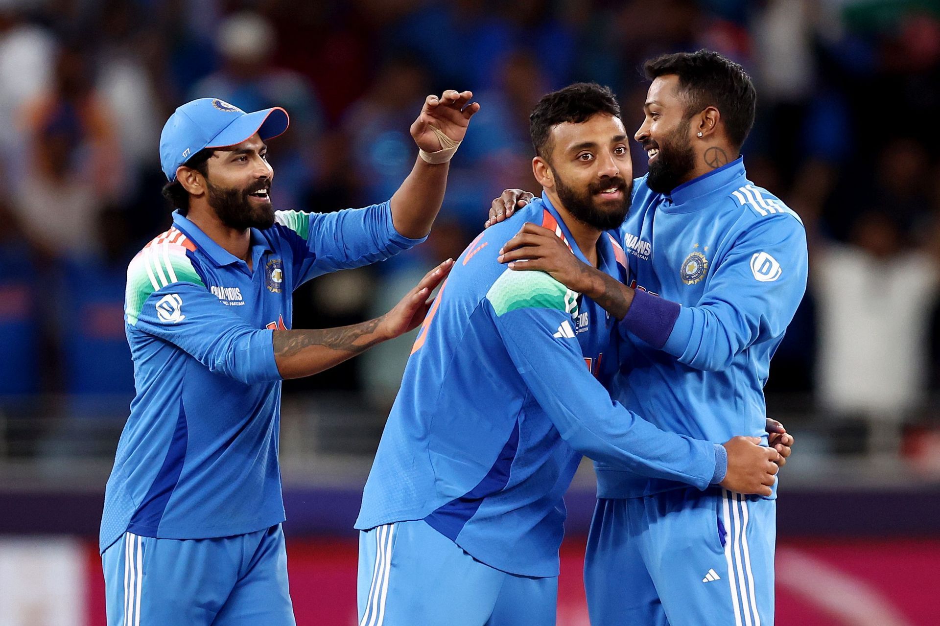 Varun Chakaravarthy (center) and Ravindra Jadeja (left) picked up four wickets between them in the 2025 Champions Trophy semi-final. [P/C: Getty]