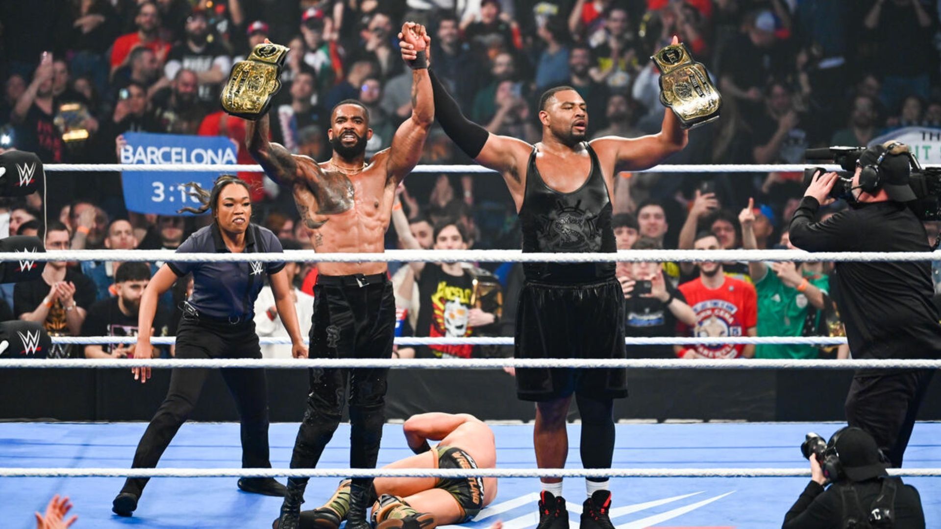 The Street Profits pose after winning the WWE Tag Team Championship (Image via WWE.com).