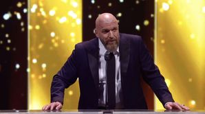 Triple H kisses male WWE icon during his Hall of Fame induction