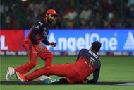 Tim David (on ground) takes the catch of the Prabhsimran Singh - Source: Getty