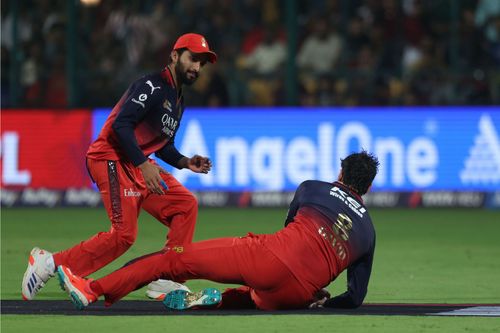 Tim David (on ground) takes the catch of the Prabhsimran Singh - Source: Getty