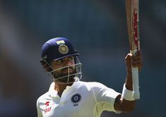 Which two Indian cricketers made their Test debut along with Virat Kohli?
