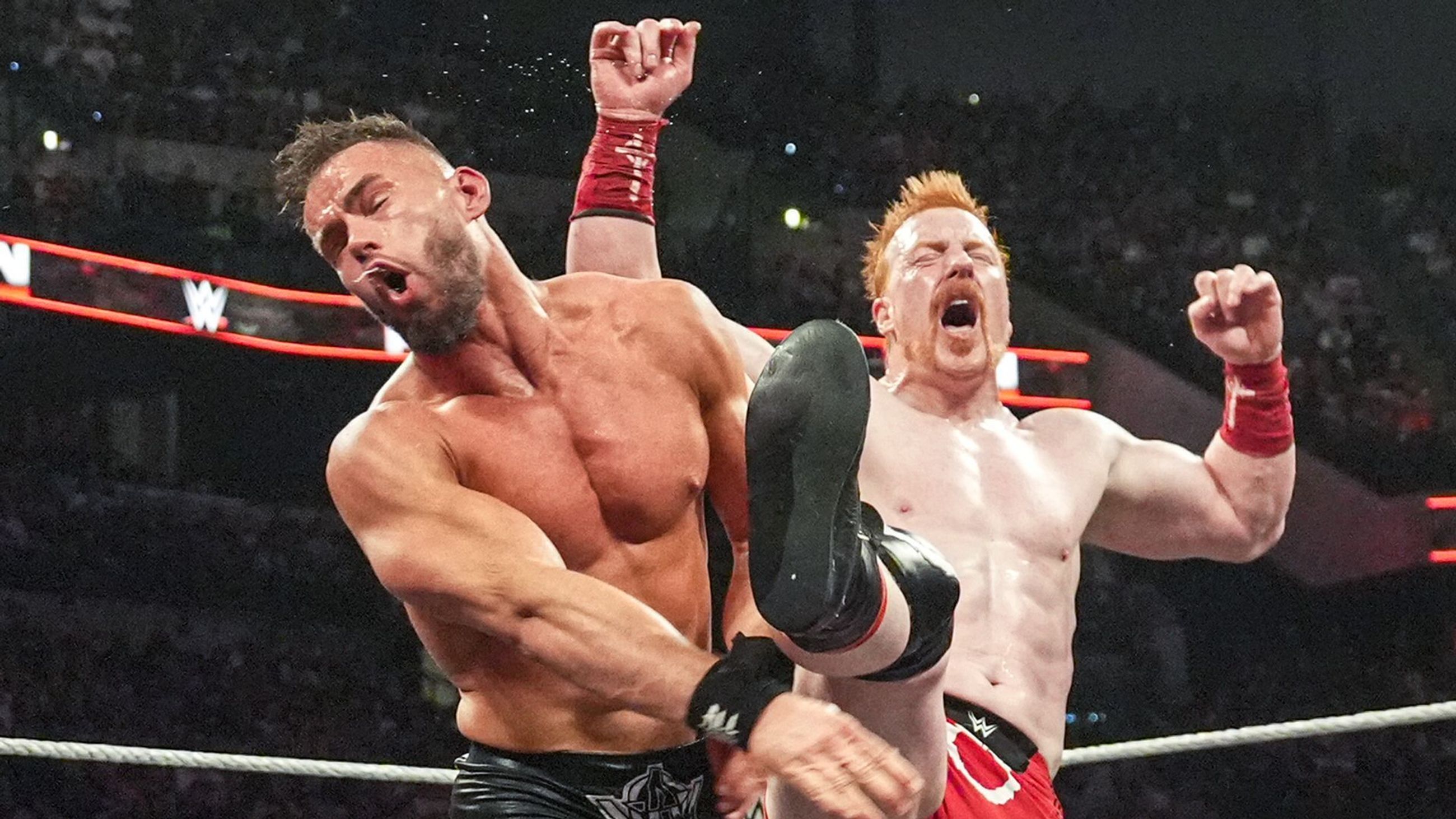 Sheamus nails the Brogue Kick on Austin Theory during WWE RAW