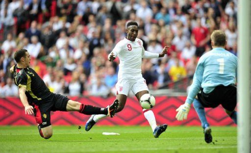 England&#039;s striker Danny Welbeck (C) scores