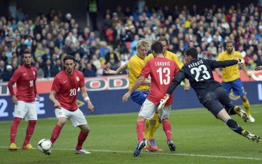 Sweden&#039;s Ola Toivonen (C) scores