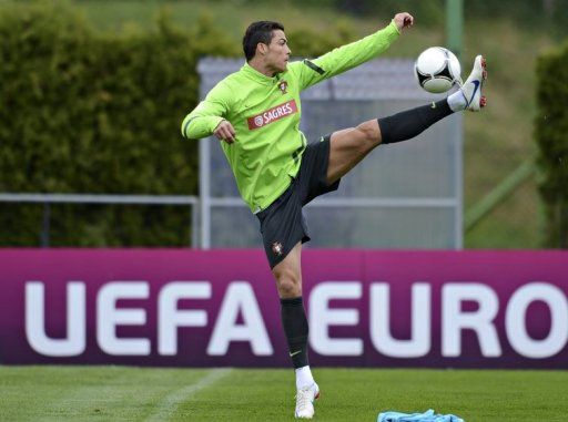 Cristiano Ronaldo controls the ball during a training session