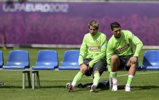 Portugal&#039;s defender Fabio Coentrao (L) and forward Cristiano Ronaldo