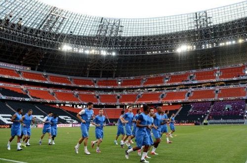 France's national football team players warm up during a training session at the training center in Kircha