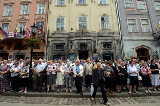 Ukrainians protest a bill broadening the rights to use the Russian language in the country in Lviv on June 10