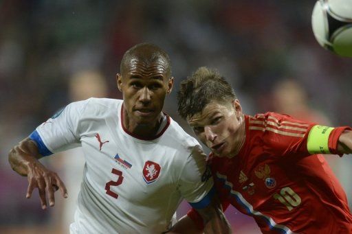 Theodor Gebre Selassie (left) vies with Russian forward Andrey Arshavin (right) during the match on June 8 in Wroclaw
