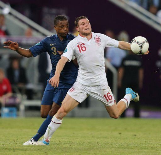 French defender Patrice Evra (L) vies with English midfielder James Milner