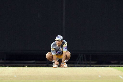 Pakistan captain Misbah-ul-Haq inspects the pitch during a practice session in Colombo Tuesday