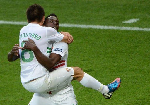 Portuguese forward Silvestre Varela (R) celebrates with Portuguese midfielder Joao Moutinho