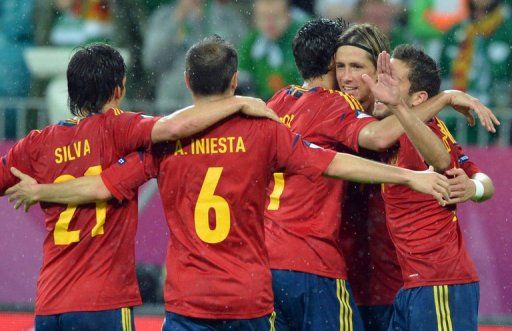 Torres&#039; double and goals by Silva and Fabregas on Thursday sent the Spanish top of Group C
