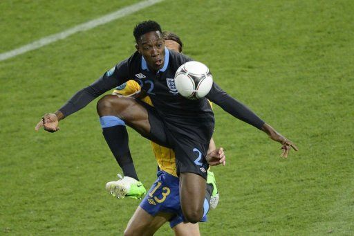 English forward Dany Welbeck jumps to control the ball