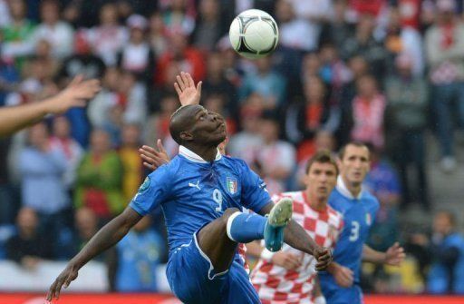 Italy&#039;s Mario Balotelli eyes the ball during his side&#039;s Euro 2012 match against Croatia