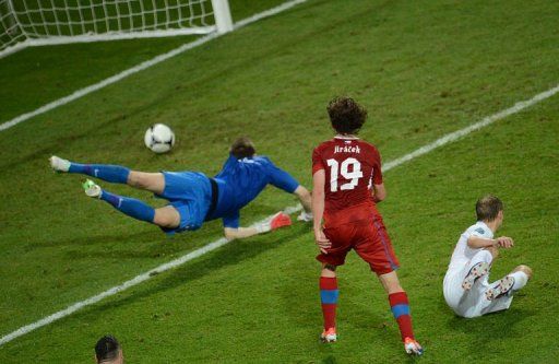 Czech midfielder Petr Jiracek (C) scores a goal