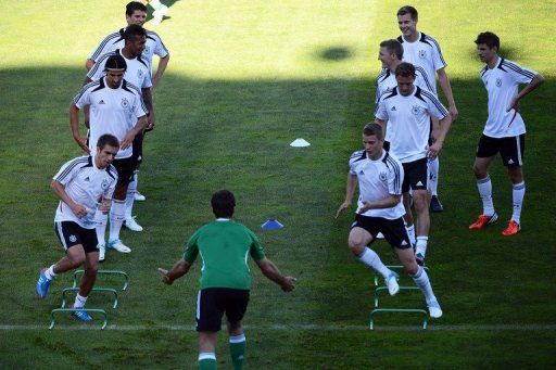 Germany&#039;s players warm up during a training session in Lviv