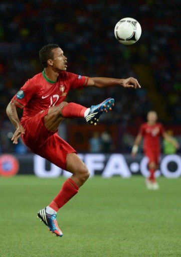 Portuguese midfielder Nani controls the ball