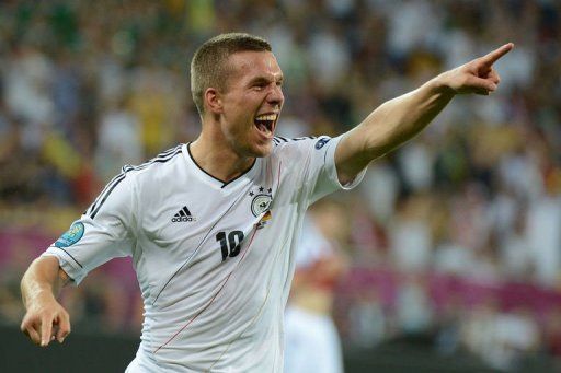 German forward Lukas Podolski celebrates after scoring