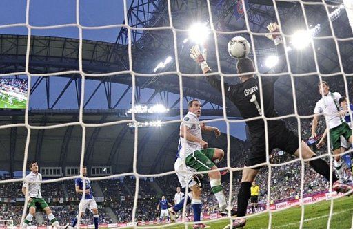 Italian forward Antonio Cassano (not seen) scores against Irish goalkeeper Shay Given