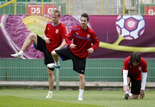 Czech midfielders Tomas Hubschman, Milan Petrzela and Tomas Rosicky, seen during a training session in Wroclaw