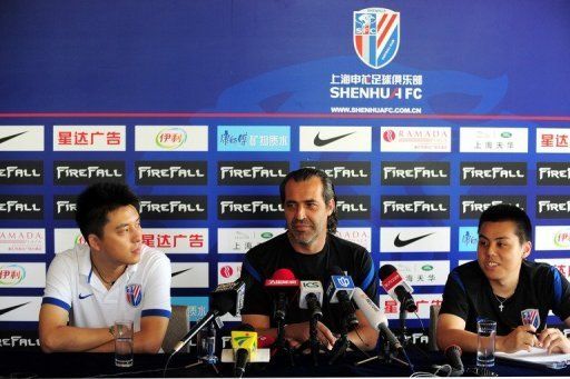 Sergio Batista (centre), head coach of Shanghai Shenhua, attends a press conference in Shanghai Thursday