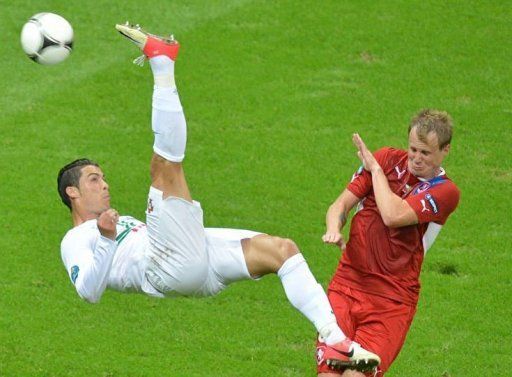 Portuguese forward Cristiano Ronaldo (L) tries to score despite Czech defender David Limbersky